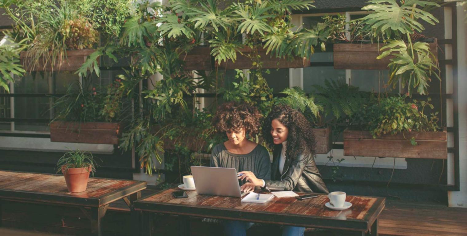 Student reading news materials and taking notes